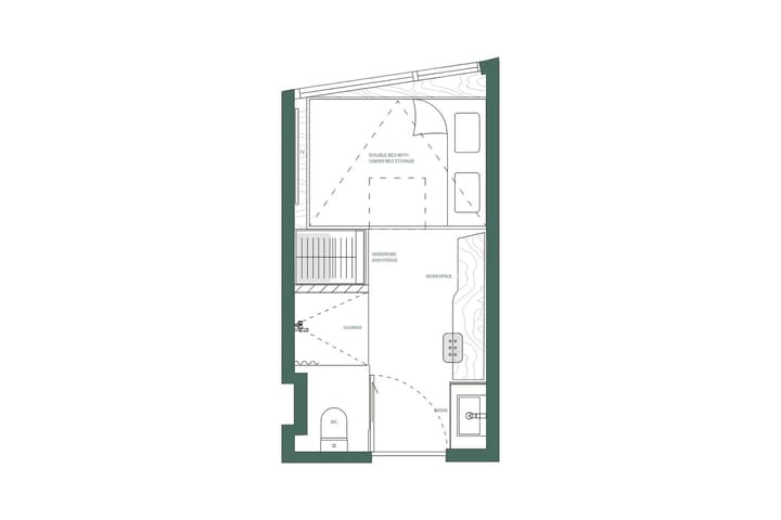 A black and white floor plan diagram for a Studio Double unit, showing a double bed with storage in a loft area (indicated by a sloped ceiling), a workspace, wardrobe, fridge, and an attached private bathroom.