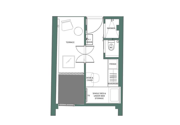 Architectural floor plan for the Midtown Urban Suite showing a layout that includes a single bed with storage, wardrobe, desk, separate bathroom with shower, and an outdoor terrace.