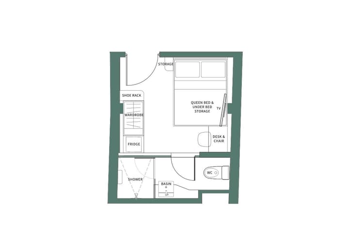 Architectural floor plan for the Midtown Skylight Suite showing a layout with a queen bed, under-bed storage, a desk, a wardrobe, and a full en-suite bathroom with a separate shower and toilet.