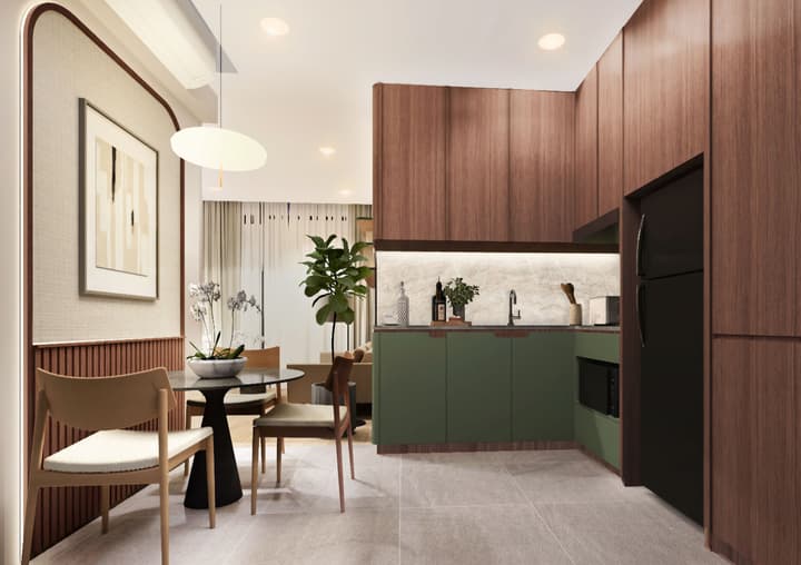 A stylish apartment kitchen and dining area with deep green lower cabinets, wood-paneled walls, a marble backsplash, and a modern dining table set for two.
