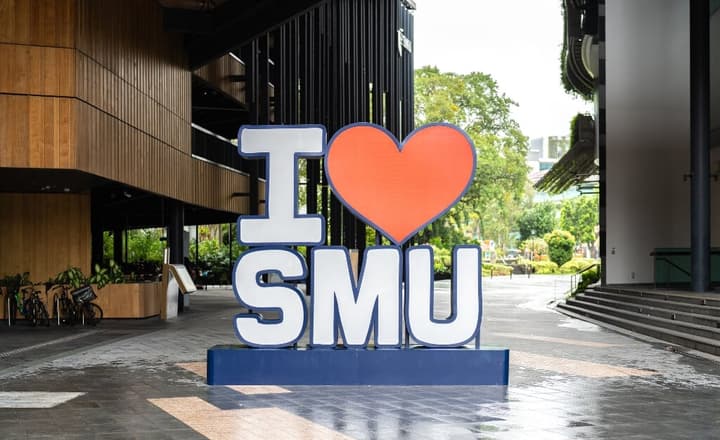 "I heart SMU" signage on a plaza, indicating the close proximity to Singapore Management University.
