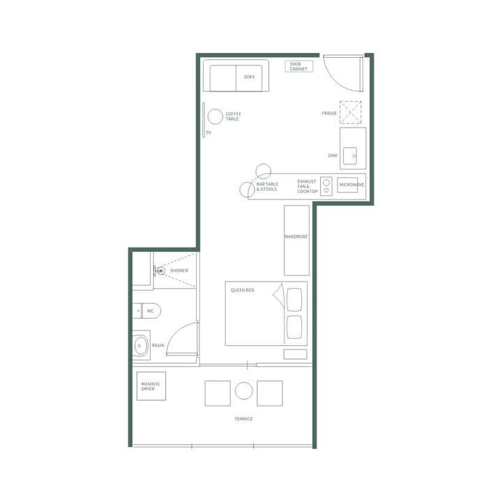 Architectural floor plan of a narrow studio apartment showing a combined kitchen, living, and bedroom area, a separate bathroom with a washer/dryer, and an outdoor terrace.