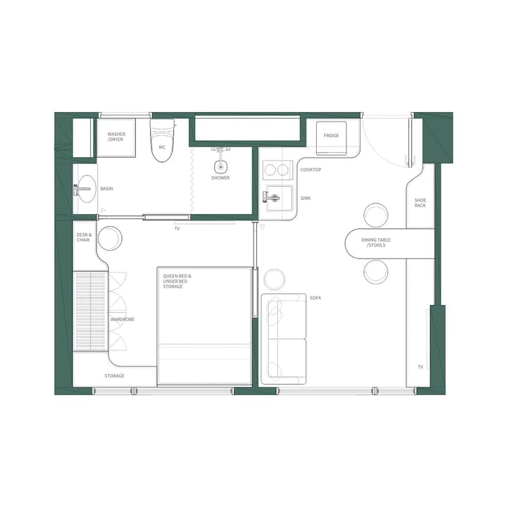 Floor plan for a Premier Studio unit showing distinct zones for the queen bed, storage, desk, and living area, with a separate kitchen featuring a cooktop, fridge, and a large bathroom with a washer/dryer unit.