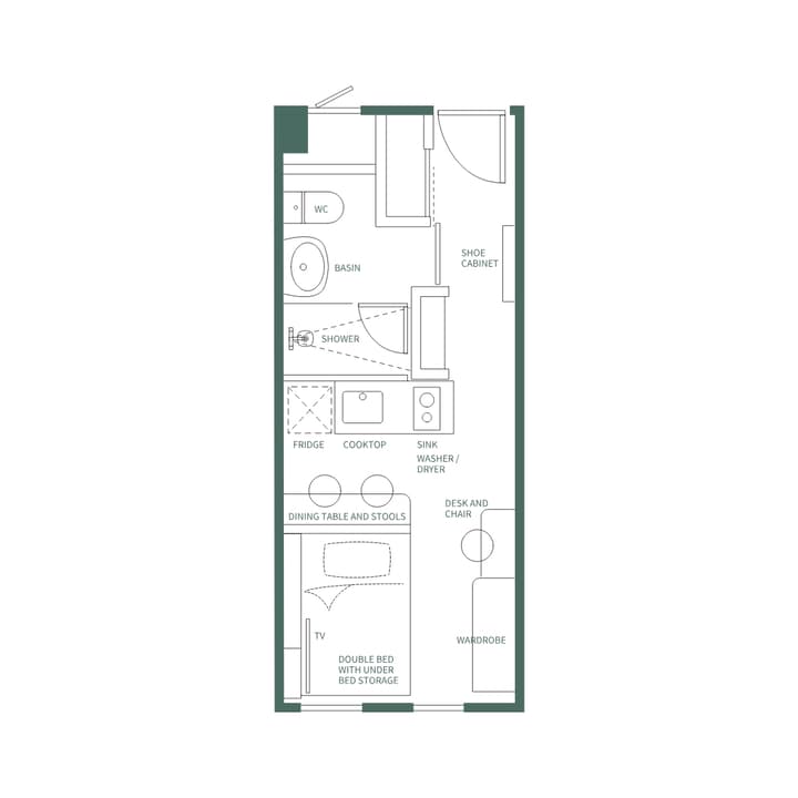 Floor plan illustration of the Premium Suite Double (Desk Layout) with English labels, showing the double bed, wardrobe, kitchen, and the long desk and chair placed next to the wardrobe.
