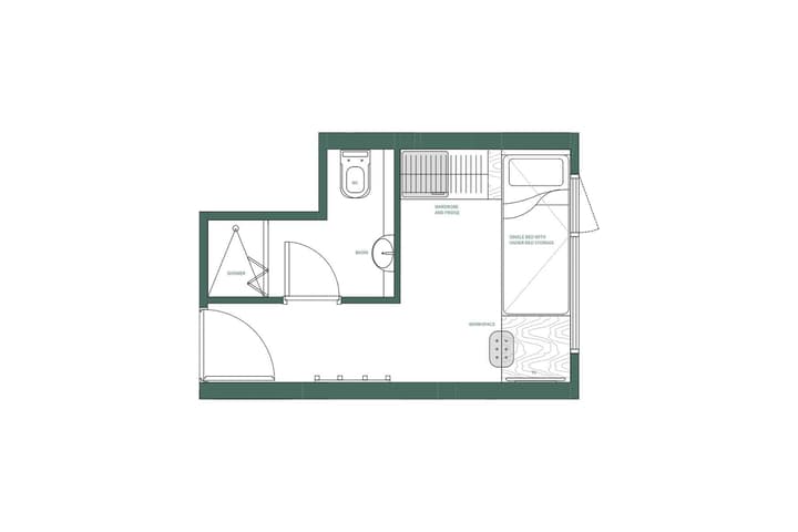 Green and white floor plan diagram for a compact single studio unit. The layout includes a single bed with under-bed storage, a wardrobe and fridge area, a small workspace with a TV, a toilet and basin, and a separate corner shower unit.