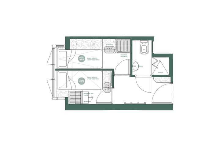 Green and white floor plan diagram for a private twin studio shared between two occupants. The layout shows two adjacent single beds with under-bed storage, two separate workspace areas with built-in storage, a shared wardrobe and fridge, and a connected bathroom with a toilet, basin, and shower.
