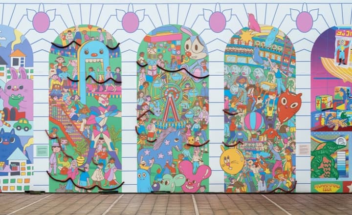Vibrant, colorful street mural featuring various cartoon characters, people, and objects set within arched panels.