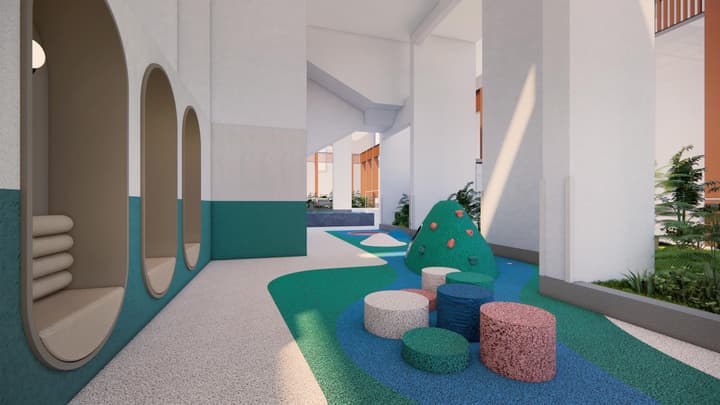 A modern, colorful indoor play area for children with soft, contoured flooring, a small climbing structure, cushioned reading nooks, and playful teal and white accents.