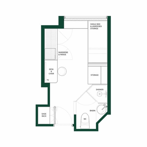 Black and white floor plan diagram for a small studio unit, illustrating the layout of a single bed with storage, a desk area, a wardrobe and fridge section, and a separate shower and WC bathroom area.
